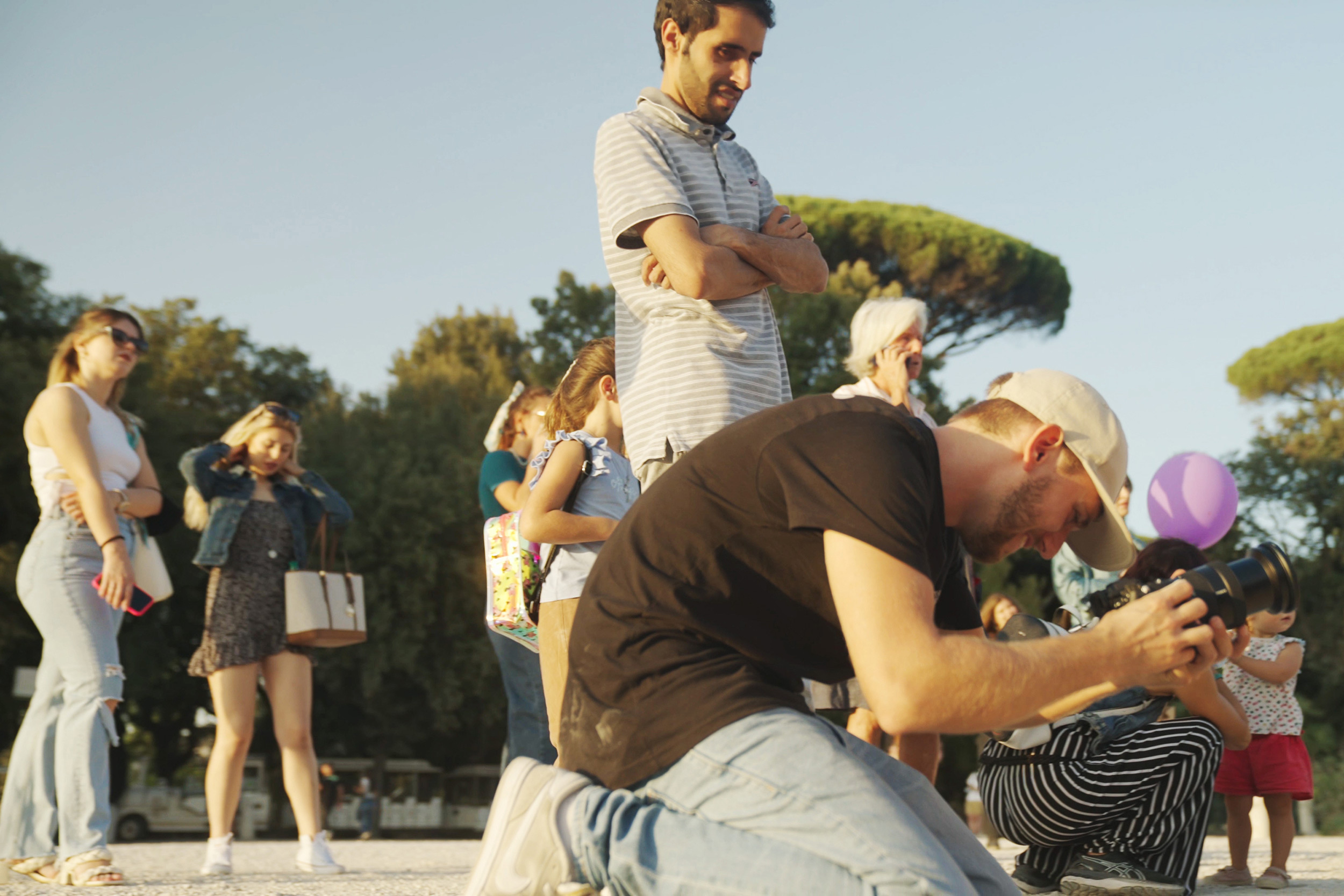 matteo-bruno-crouching-down-as-he-frames-a-shot-on-his-sony-alpha-camera.jpeg
