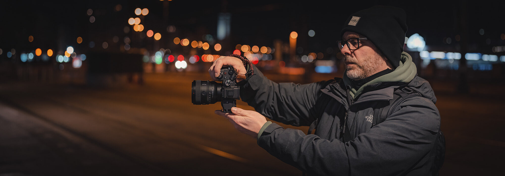 oliver-wallner-holding-his-alpha-7m4-with-sel50f14gm-attached-2000x700-1_landscape_2000x700.jpg