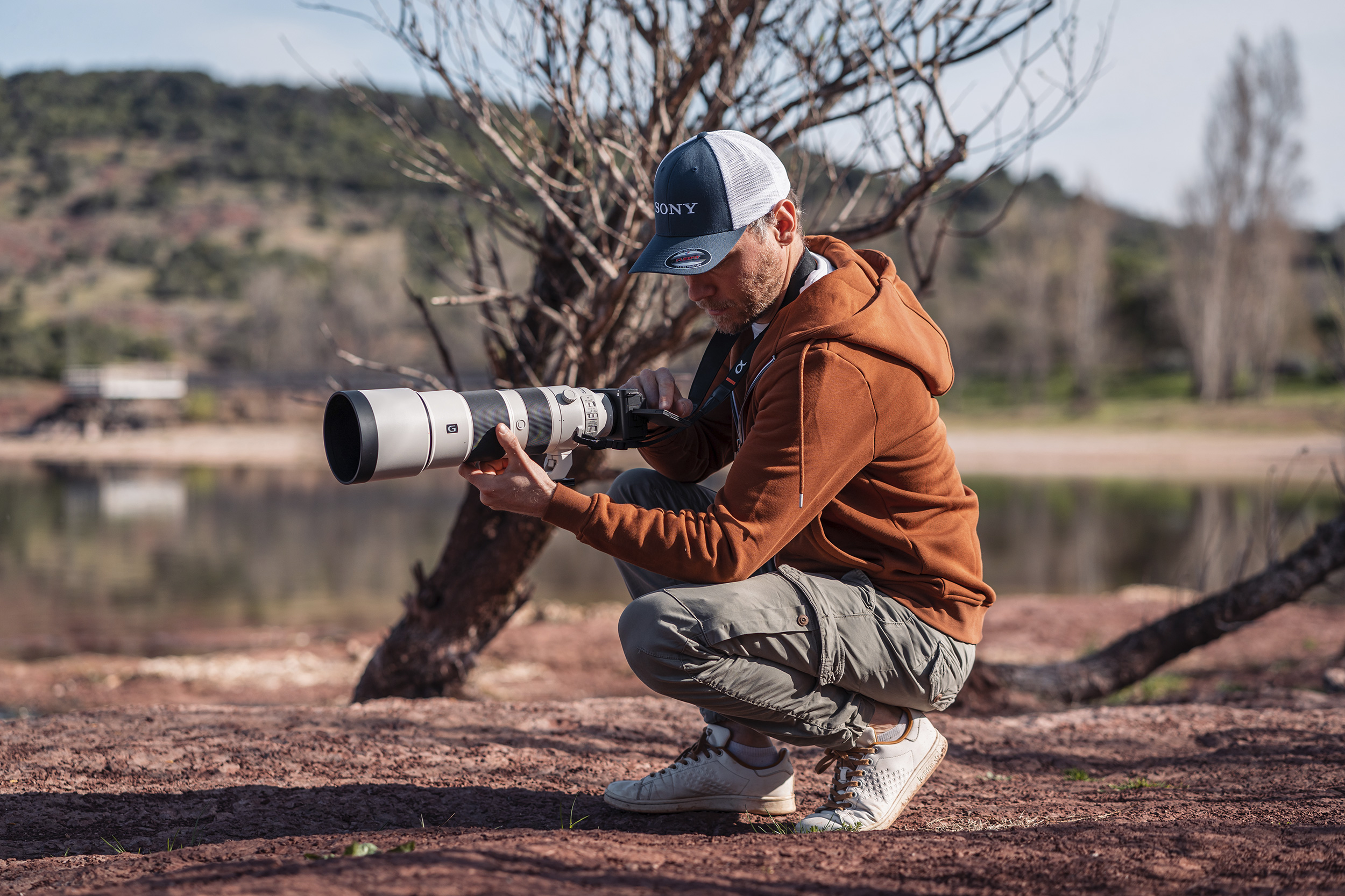 olivier-schmitt-crouching-with-his-sony-zv-e1.jpg