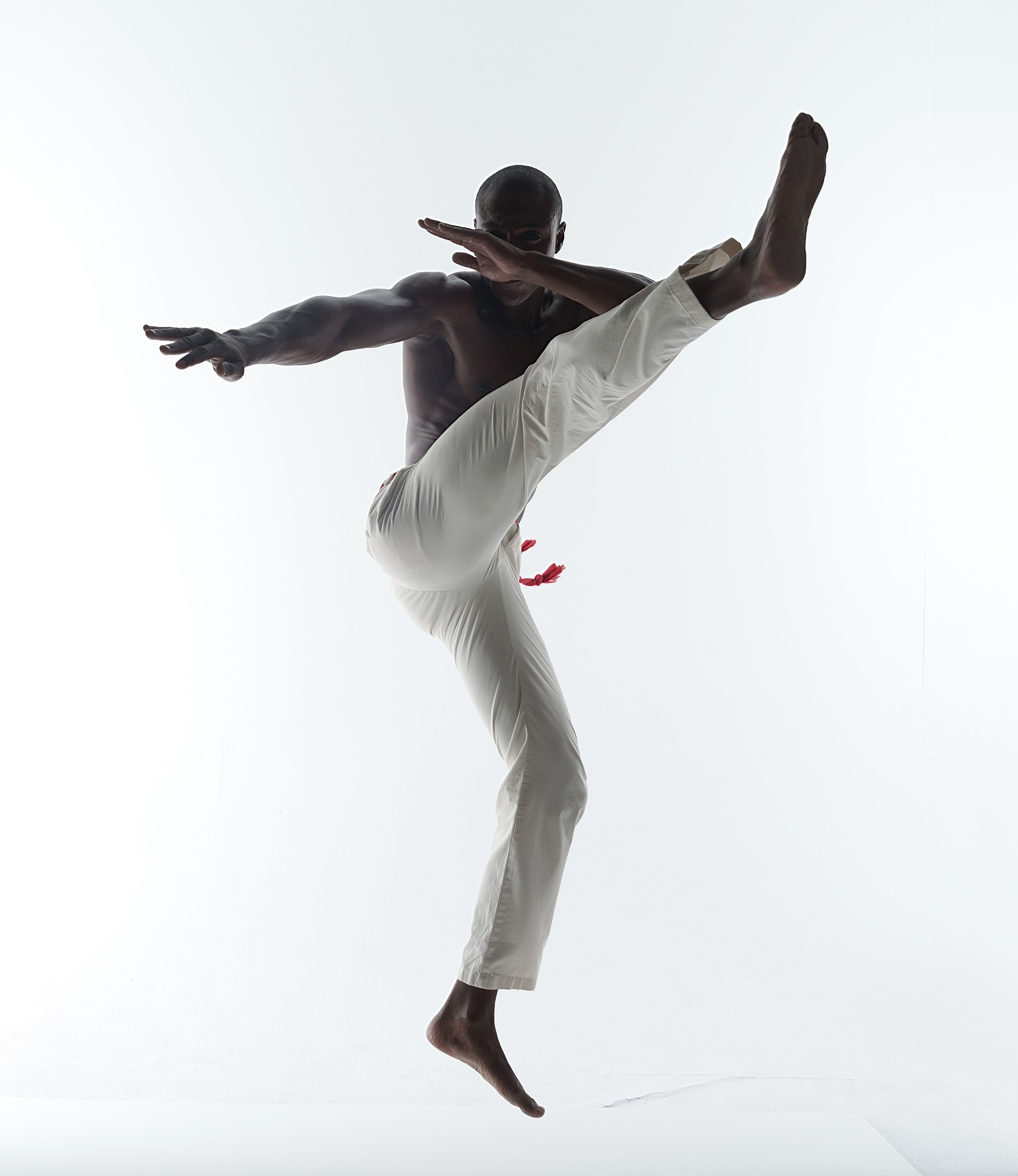 male-model-kicking-his-leg-in-mid-air.jpg