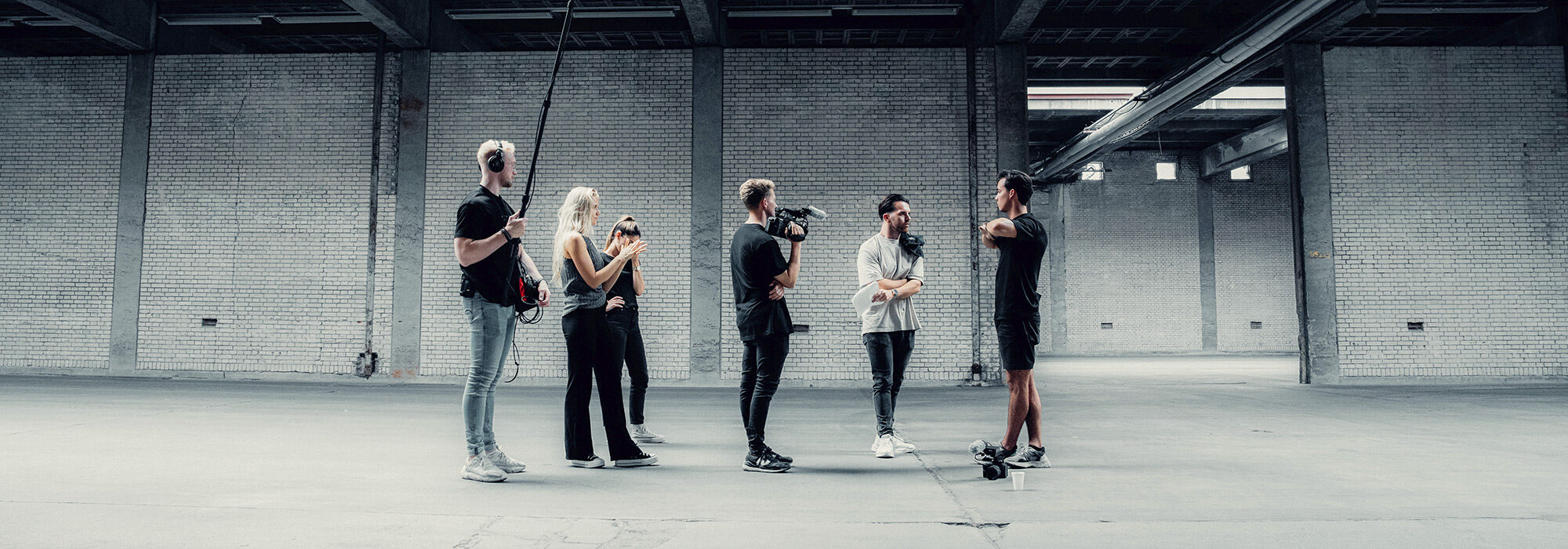 group-of-filmmakers-standing-in-a-large-space-2000x700-1_landscape_2000x700.jpg
