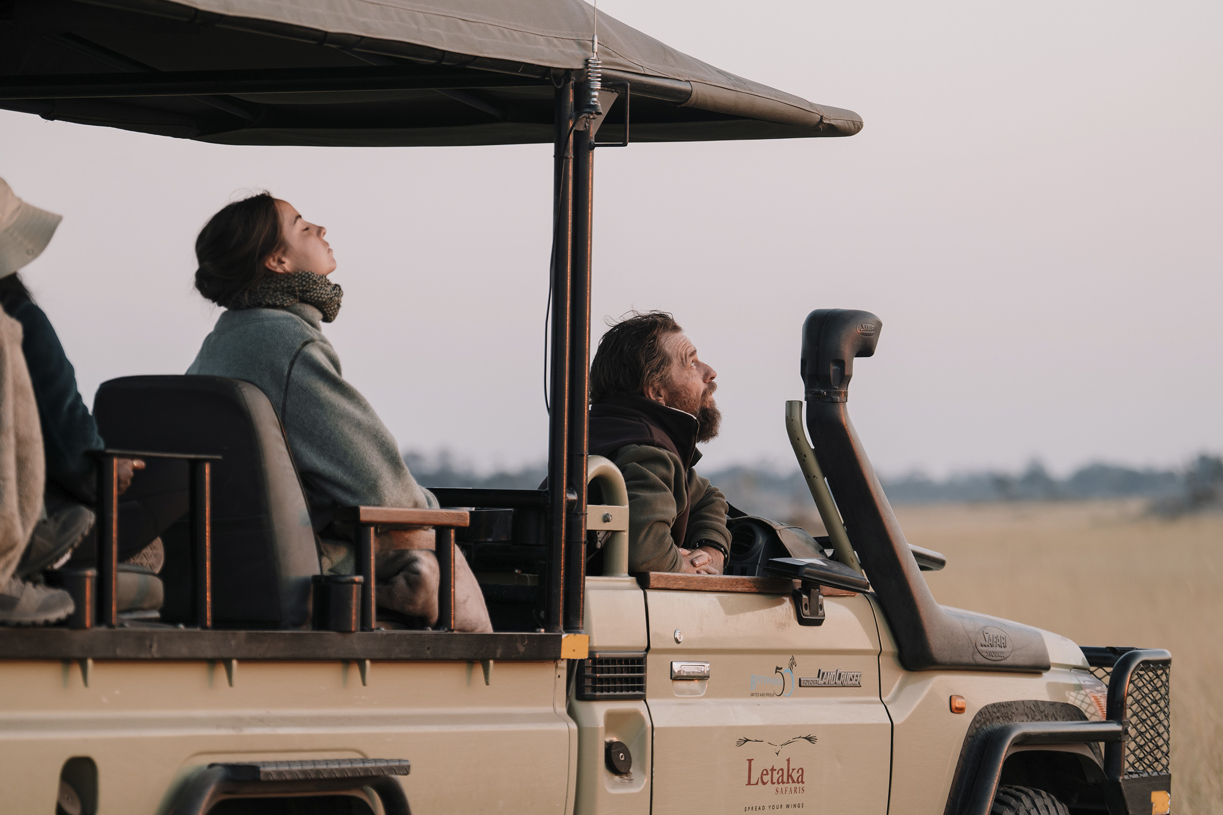 safari-tourists-sitting-in-a-jeep.jpg