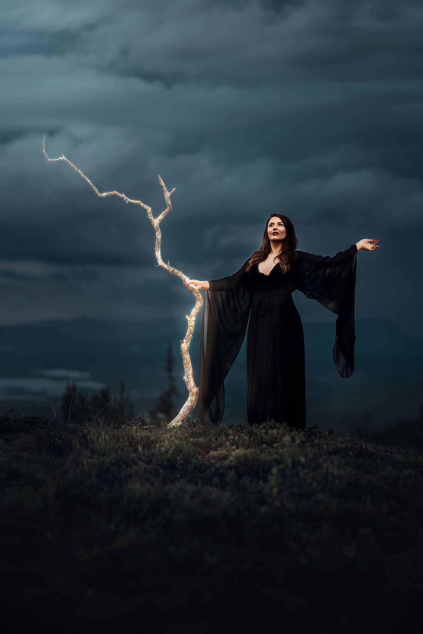 lady-in-a-black-dress-holding-a-stick-.jpg